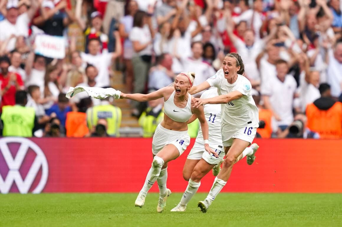 Chloe Kelly #18 of England celebrates after scoring her team's second goal with teammates.