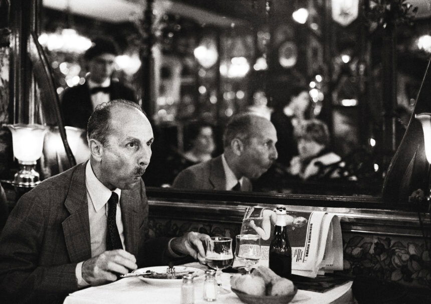 Black and white photo from the series 'Restaurant and Café Visitors' by Vera Mercer, taken in the 1960s.