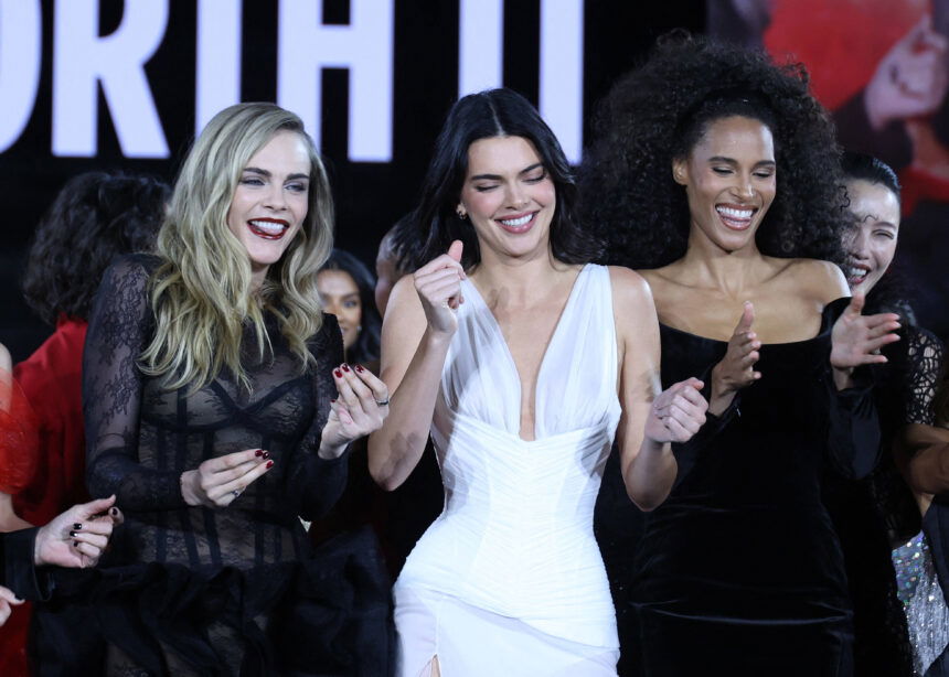 Cara Delevingne, Kendall Jenner, and Cindy Bruna at the L'Oréal Spring/Summer 2026 fashion show.
