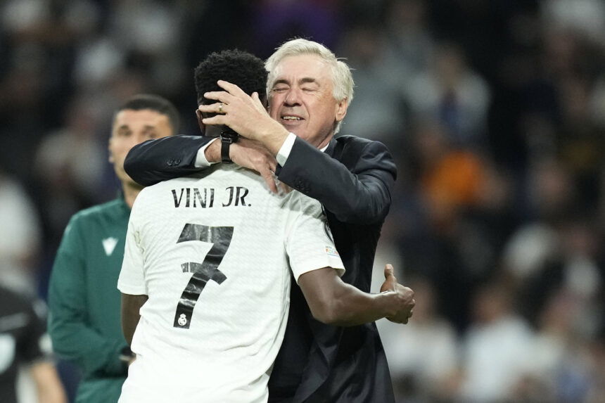 Vinicius Jr hugs Carlo Ancelotti